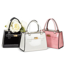 Load image into Gallery viewer, Handbag-shaped ceramic vase with faux leather handle and chic hardware-style detail, available in white, black, and pink