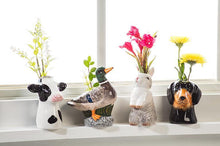 Load image into Gallery viewer, Ceramic Holstein cow head bud vase in glossy black and white with a small opening at the top, shown on a white background