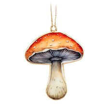 Load image into Gallery viewer, Set of two double-sided metal mushroom ornaments in red and taupe with hanging loops, about 4 inches tall.