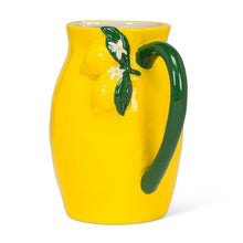 Load image into Gallery viewer, Glossy yellow ceramic lemon pitcher with green handle and sculpted lemon detail