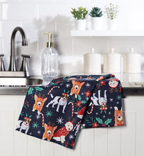 Load image into Gallery viewer, Paws and Peppermint holiday dog kitchen towel with festive dogs candy canes poinsettias and winter stars on navy