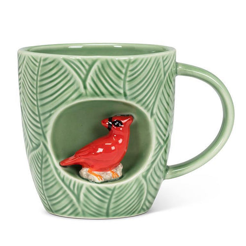 Green leaf-textured stoneware mug with a red cardinal figurine in an alcove, 12 oz