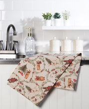 Load image into Gallery viewer, Natural cotton Christmas kitchen towel with festive bears, trees, greenery, gifts, and woodland holiday details
