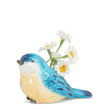 Load image into Gallery viewer, Ceramic bluebird bud vase in blue and white with a small opening, shown holding a few white flowers
