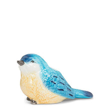 Load image into Gallery viewer, Ceramic bluebird bud vase in blue and white with a small opening, shown holding a few white flowers
