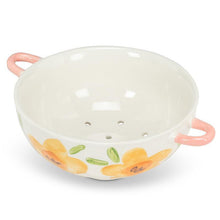 Load image into Gallery viewer, Ivory stoneware colander with yellow floral pattern, green leaves, and pink handles
