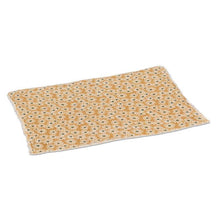 Load image into Gallery viewer, Yellow cotton placemat with white daisy floral pattern and green centres
