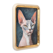 Load image into Gallery viewer, Gold-framed wall art featuring a modern hairless cat portrait with pink tones on a deep blue background
