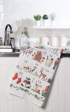 Load image into Gallery viewer, White cotton advent calendar kitchen towel with colourful Christmas icons including reindeer, snowmen, stockings, ornaments, and candy canes
