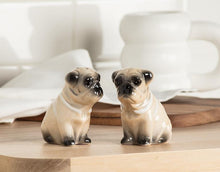 Load image into Gallery viewer, Ceramic pug salt and pepper shaker set in a warm sand finish with glossy black face details
