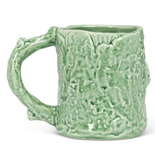 Load image into Gallery viewer, Green bark-textured stoneware mug with a red toadstool in an alcove, 11 oz
