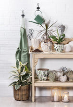 Load image into Gallery viewer, Green utility apron styled for cooking and home projects
