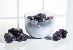 Fragrance bowl with natural amethyst crystals and essential oils in lavender, rose geranium, bergamot, and rosewood.