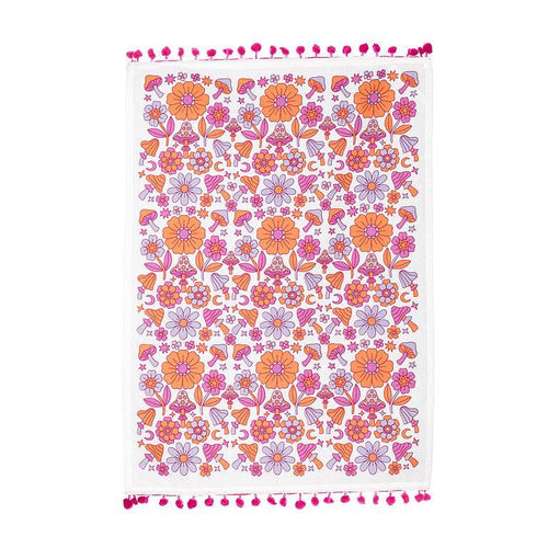 Cotton kitchen towel with graphic mushroom and floral design in pink, purple, and orange.