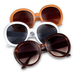 Oversized round frame sunglasses with glossy finish and UV-protective lenses.